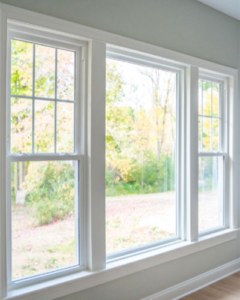 Livingroom, one center picture window with a single hung window on each end.